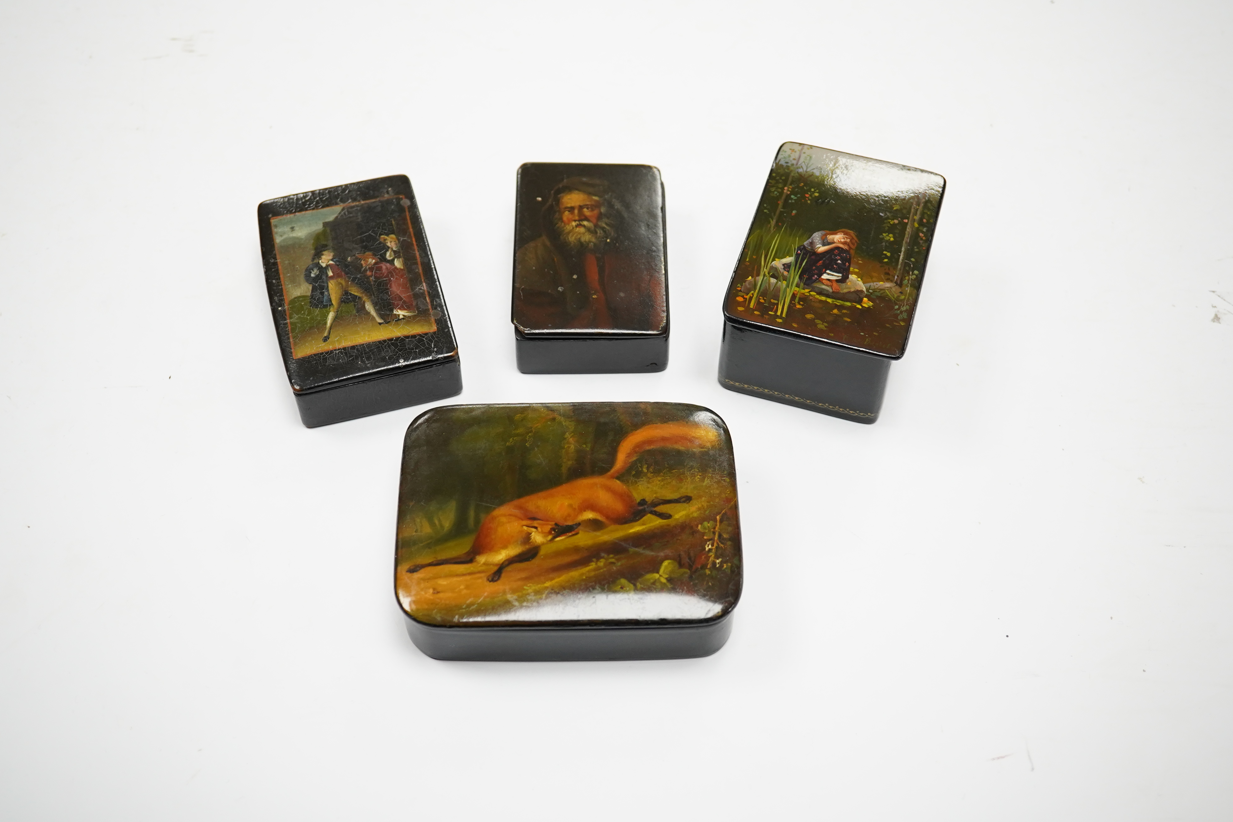 Four late 19th/early 20th century Russian lacquer boxes, largest 10.5cm. Condition - fair to good